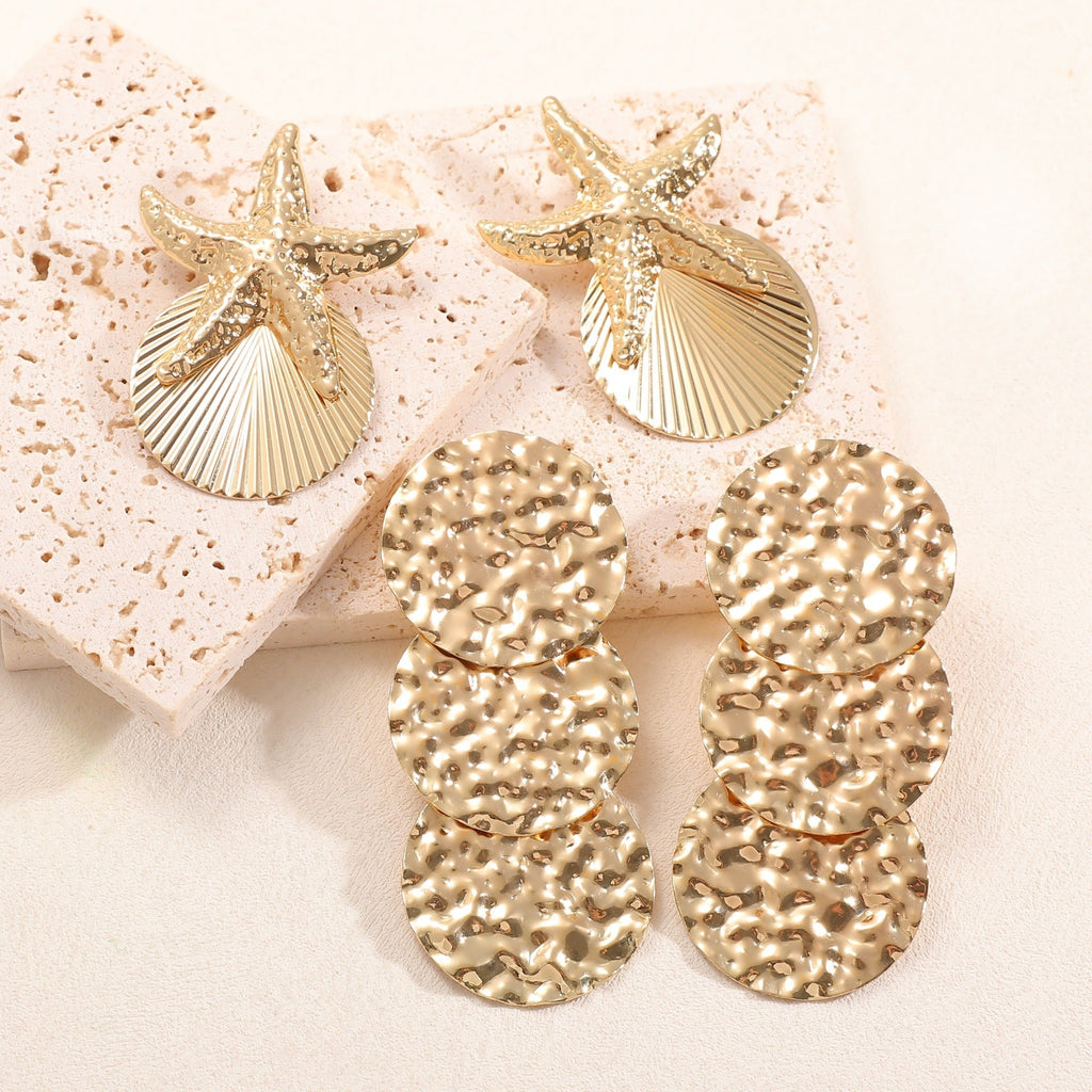 Women's ear clips in luxurious shell and starfish design