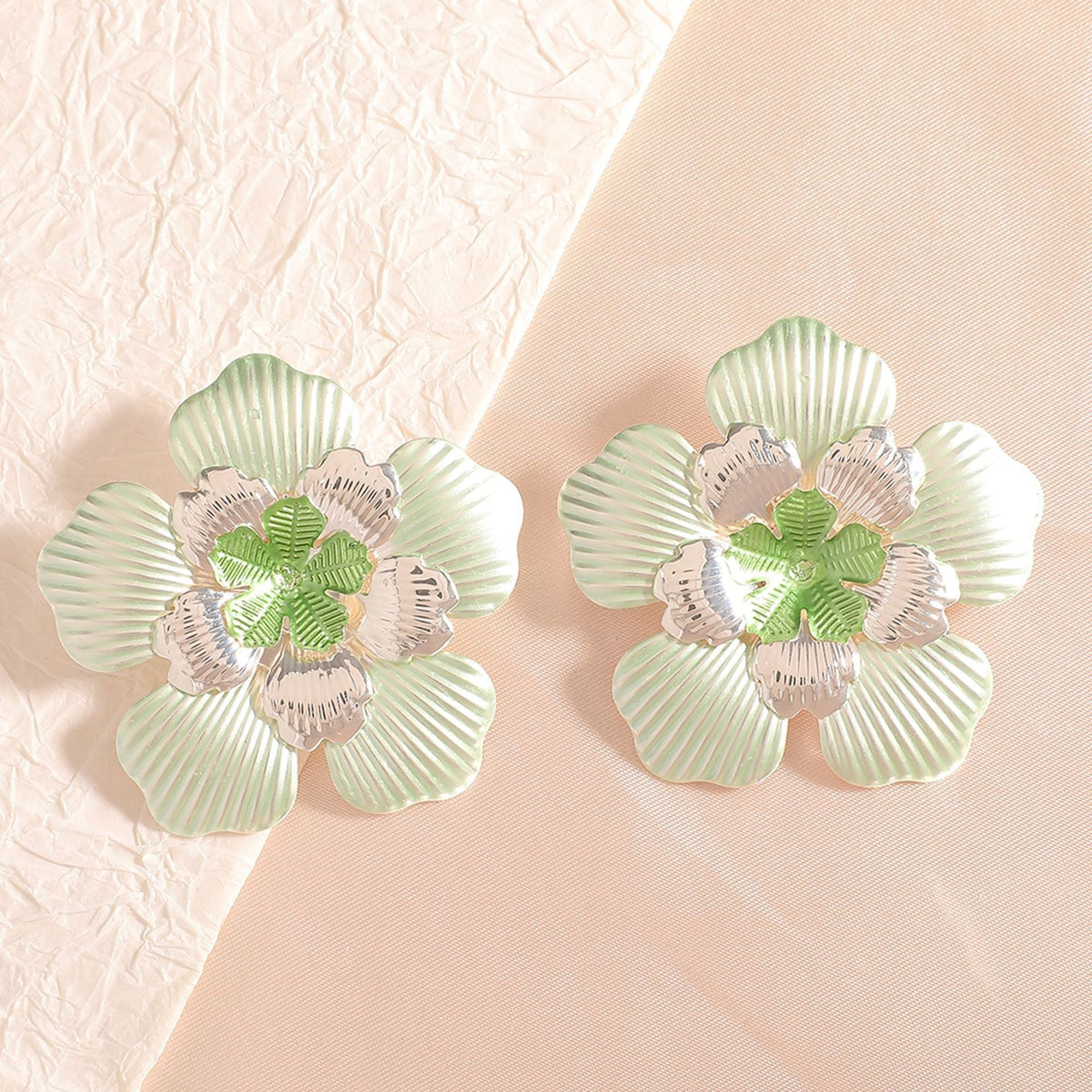 Ladies' flower earrings with intricate design and glossy accents