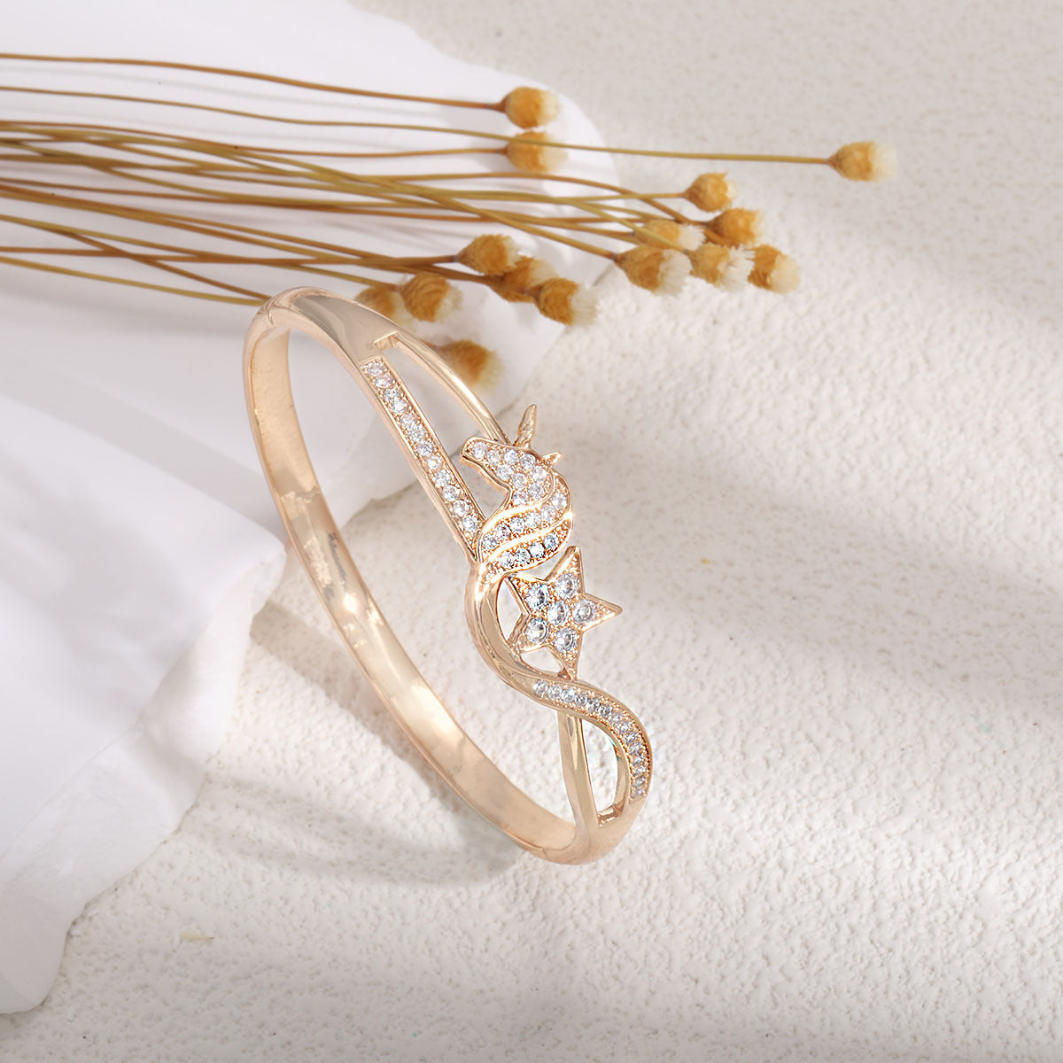 Women's bangle with elegant infinity pattern and sparkling zirconia
