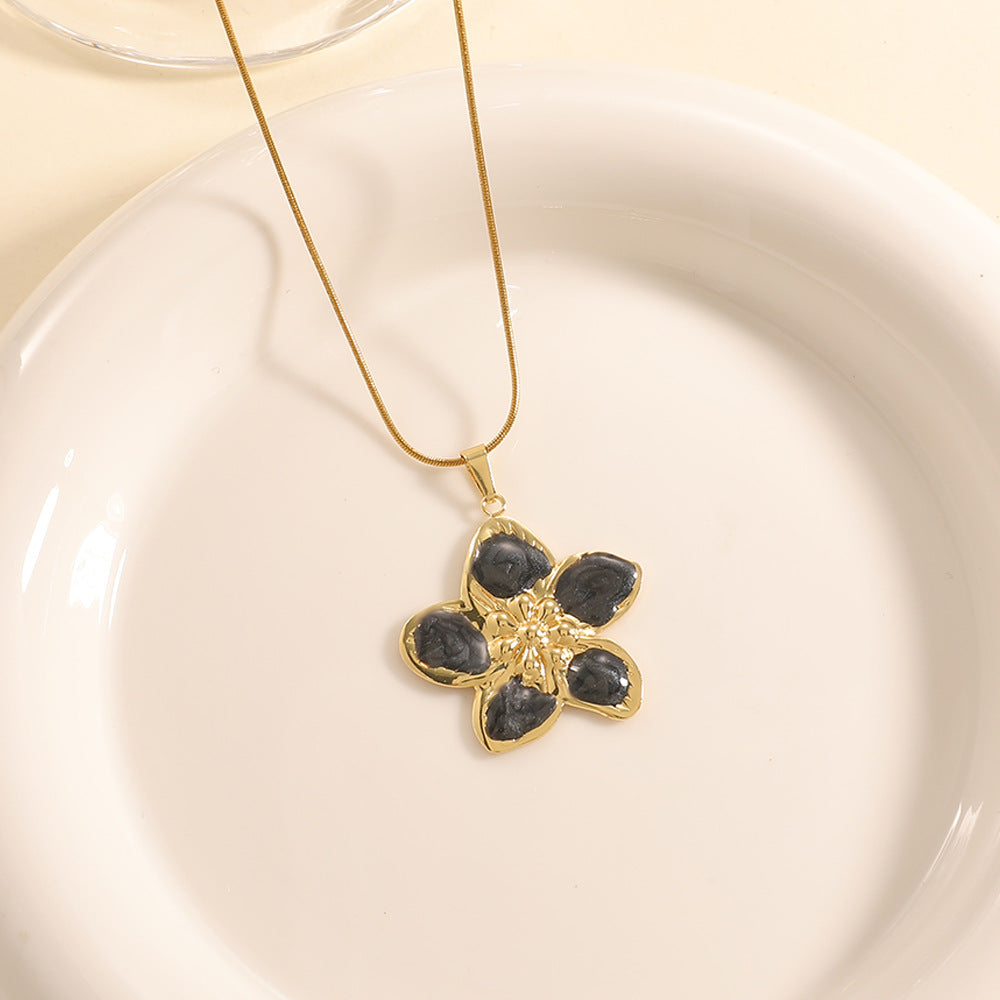 Women’s necklace with elaborately designed flower pendant