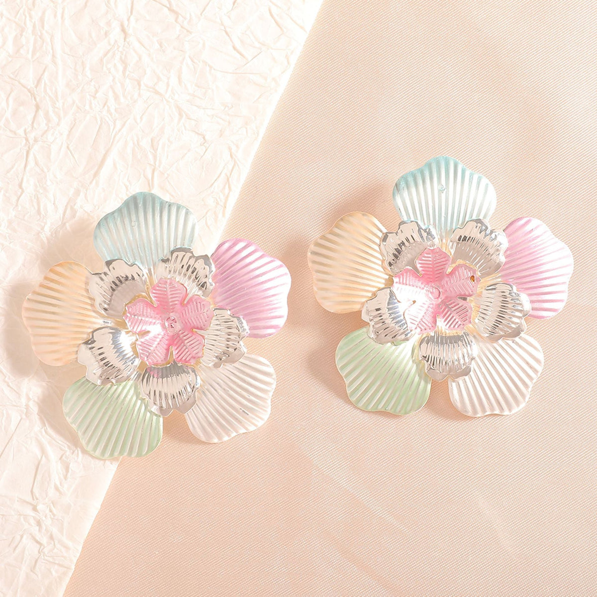 Ladies' flower earrings with intricate design and glossy accents