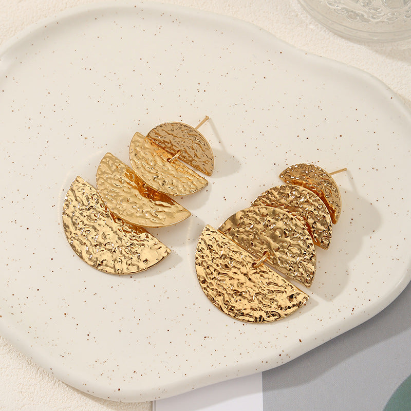 Women's elegant earrings with rustic, folded design