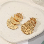 Women's elegant earrings with rustic, folded design