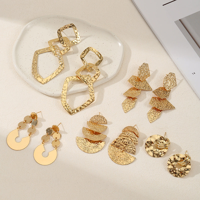 Women's elegant earrings with rustic, folded design