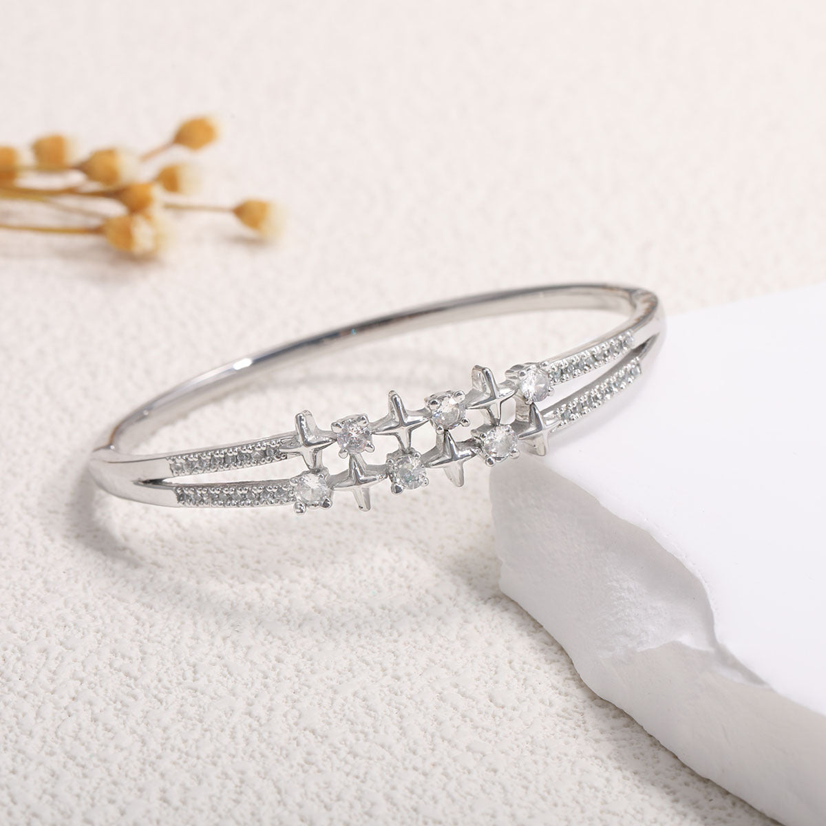 Ladies bracelet with elaborate infinity symbol and sparkling zirconia