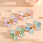 Women's ear clips in elaborate floral pattern
