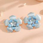 Ladies' flower earrings with intricate design and glossy accents