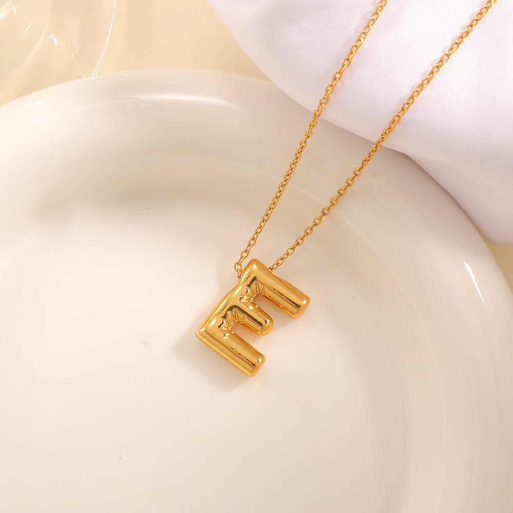 Women's necklace with curved letter pendant