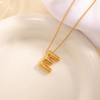 Women's necklace with curved letter pendant