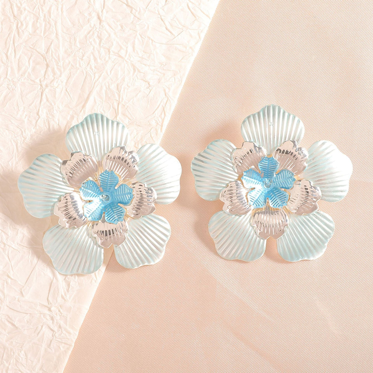 Ladies' flower earrings with intricate design and glossy accents