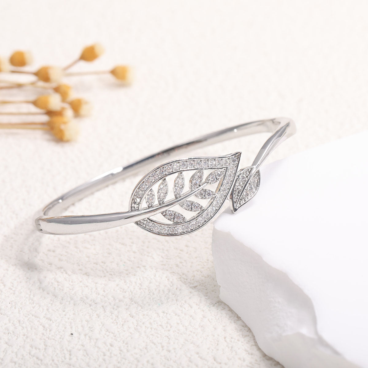Ladies bracelet with elaborate infinity symbol and sparkling zirconia