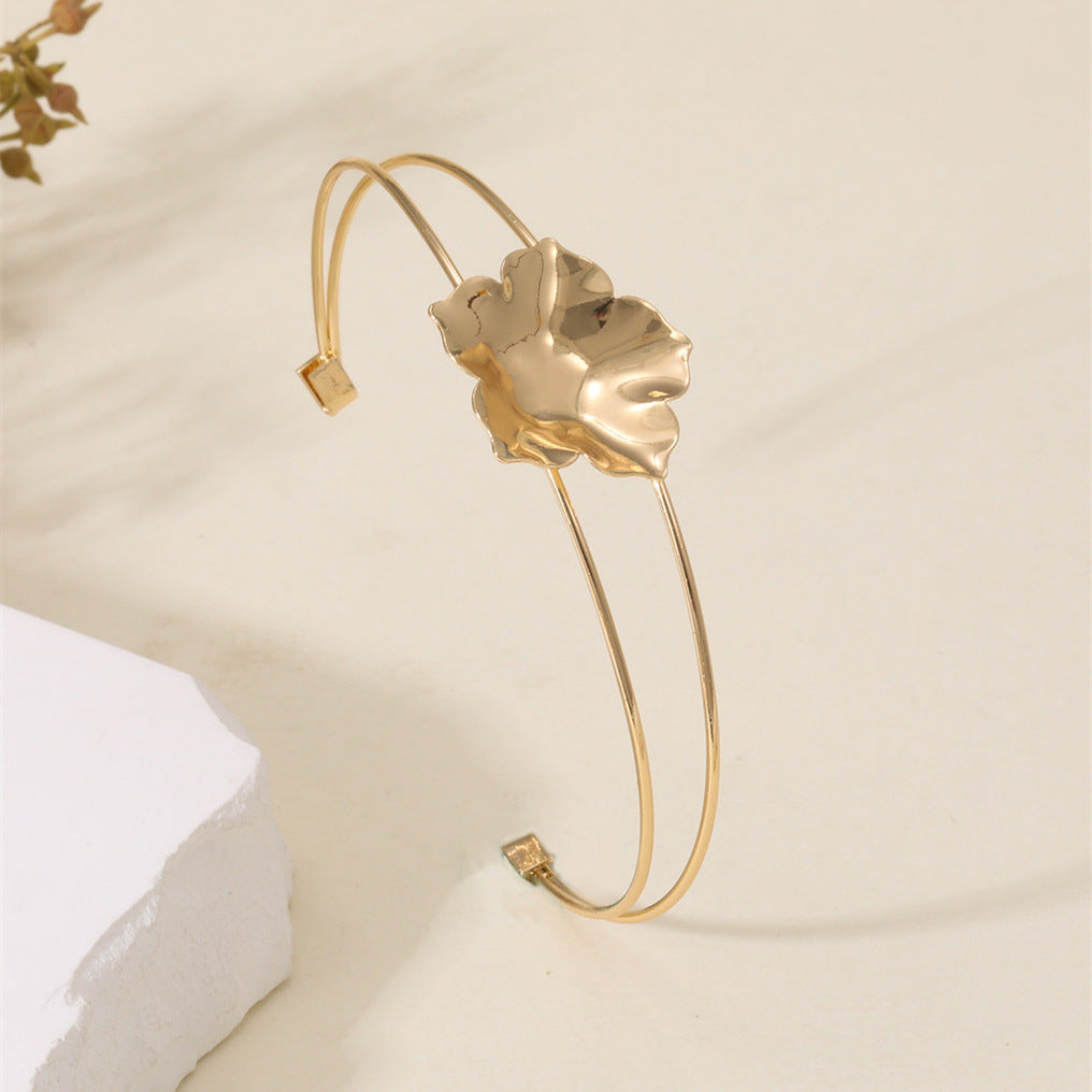 Women's cuff bracelet with artistic leaf motif