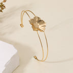 Women's cuff bracelet with artistic leaf motif