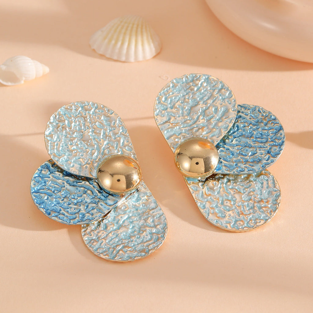 Women's ear clips in elaborate floral pattern