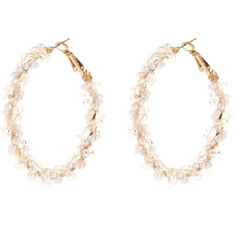 Ladies hoop earrings with luxurious pearl accents and elegant, twisted design