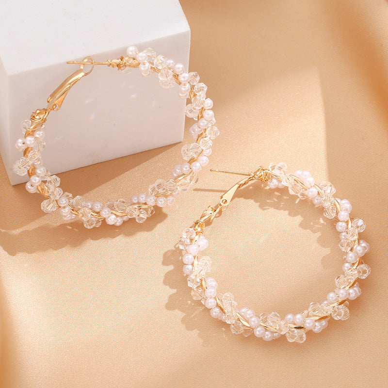 Ladies hoop earrings with luxurious pearl accents and elegant, twisted design