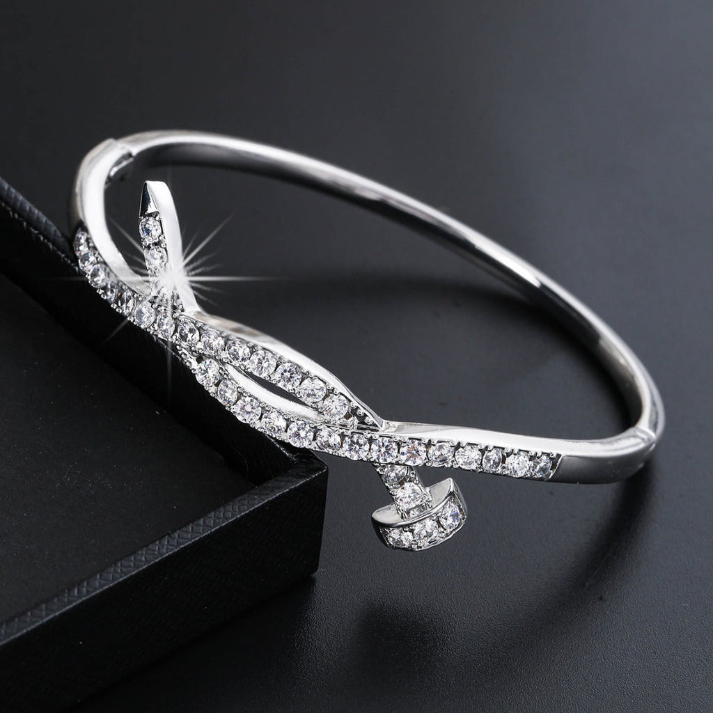 Ladies bracelet with elaborate infinity symbol and sparkling zirconia