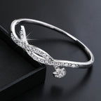 Ladies bracelet with elaborate infinity symbol and sparkling zirconia