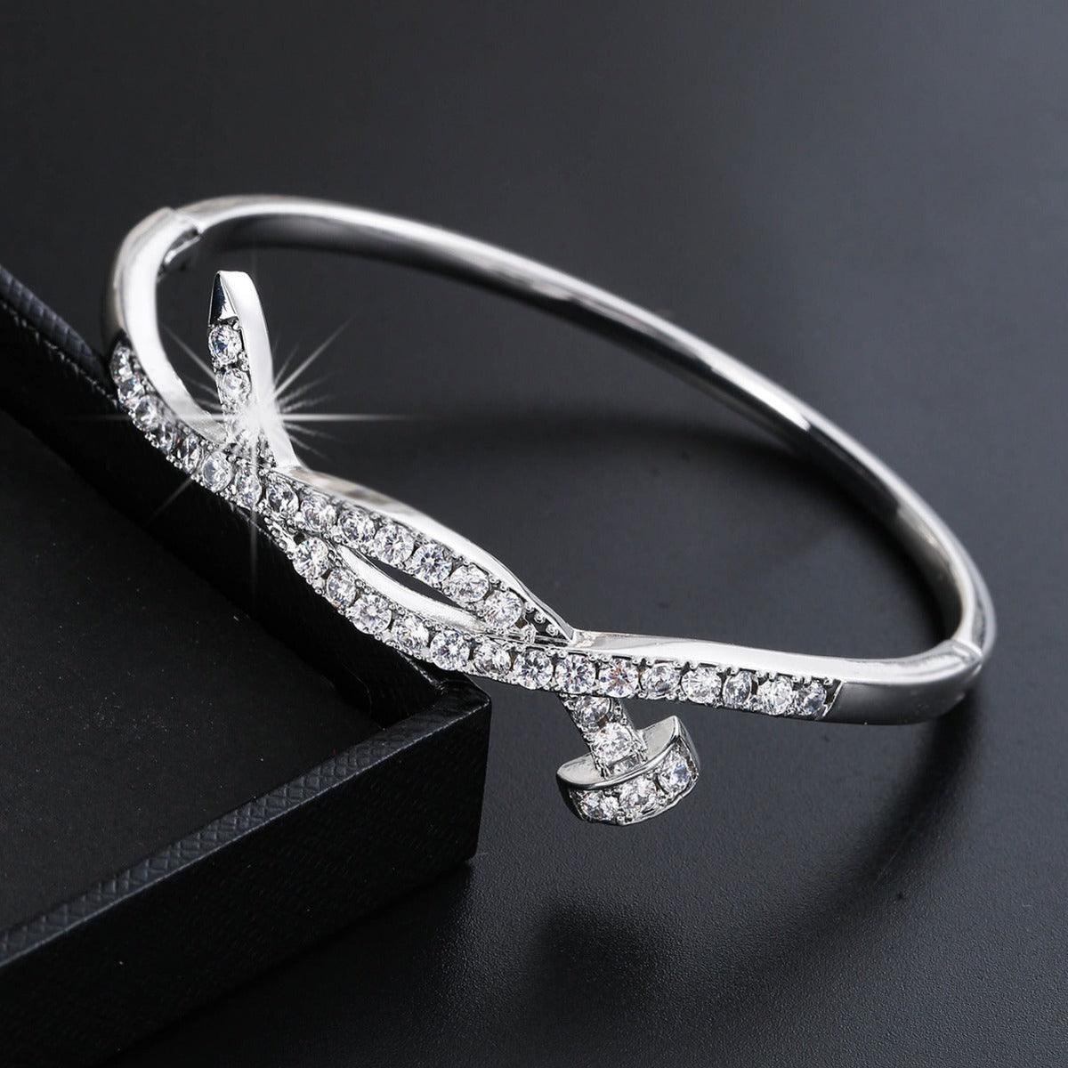 Ladies bracelet with elaborate infinity symbol and sparkling zirconia