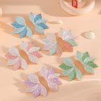 Women’s hair accessory with elaborate leaf design