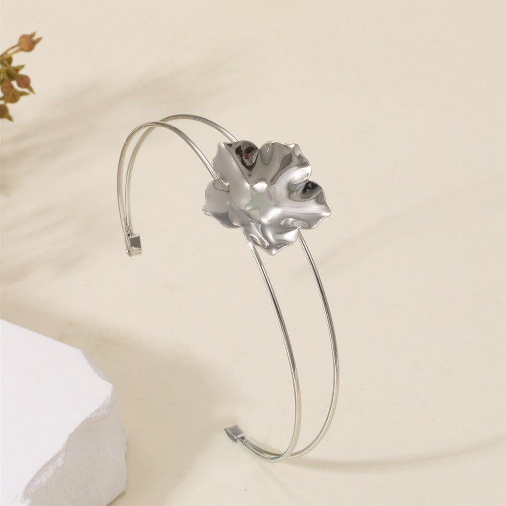 Women's cuff bracelet with artistic leaf motif