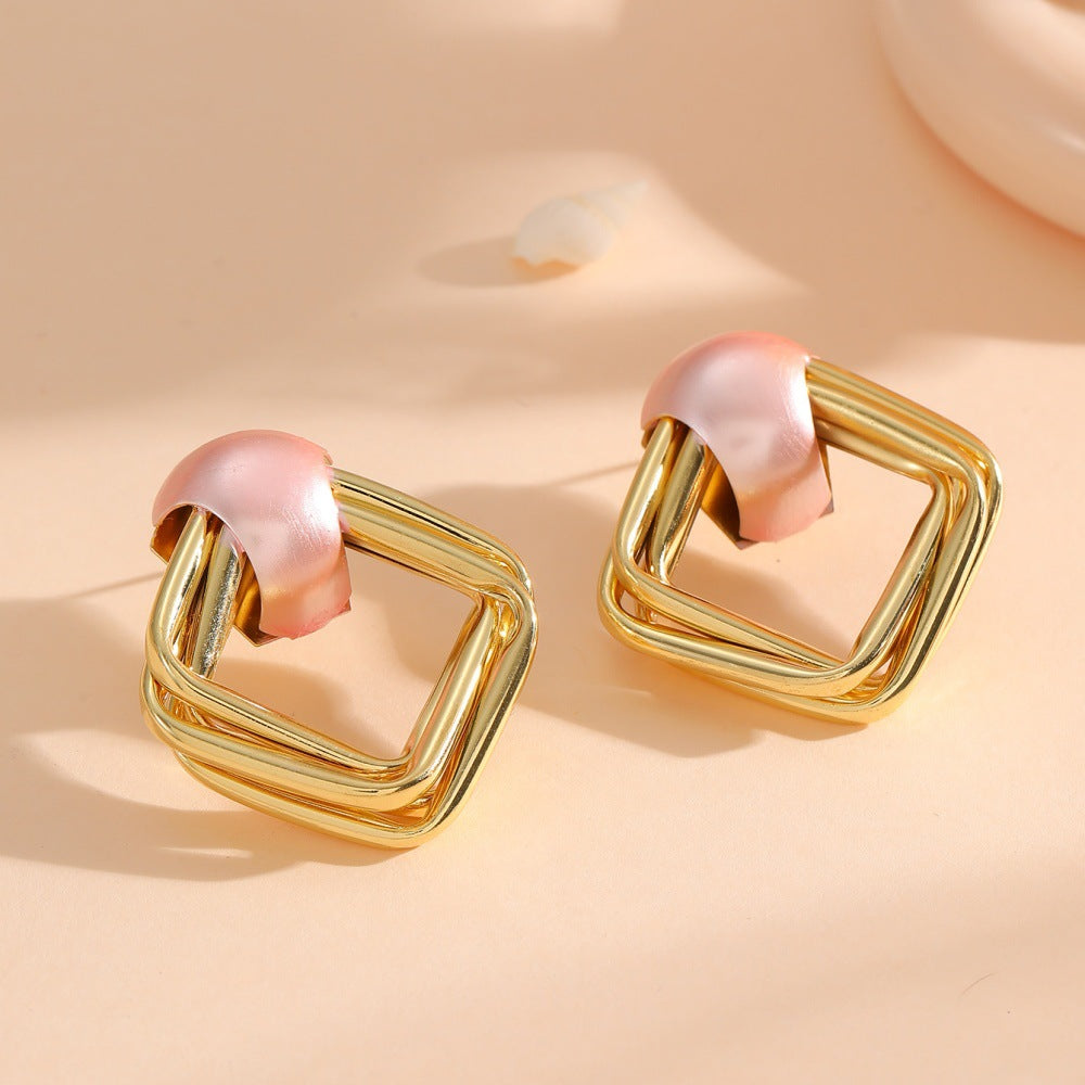 Women modern earrings with asymmetrical design