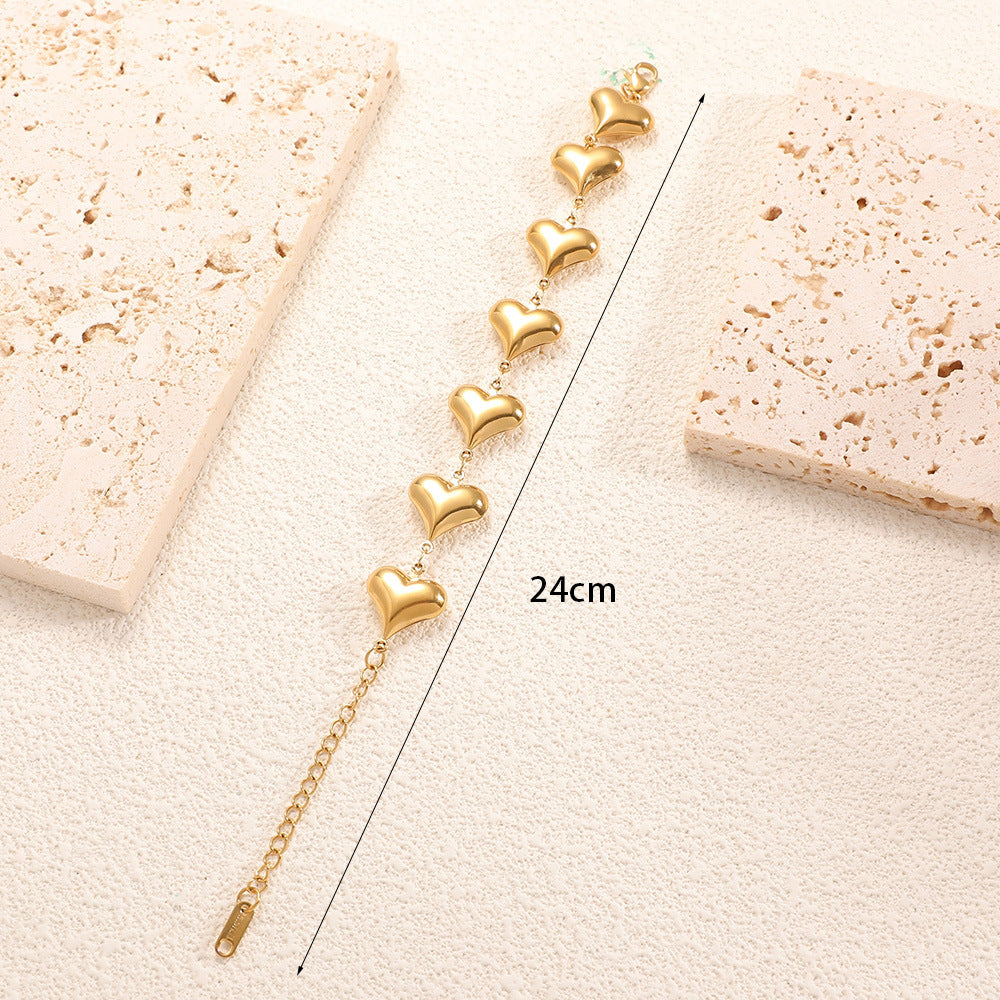 Ladies' bracelet with elegant heart design and fine link chain