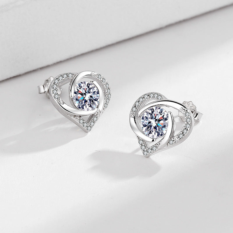 Ladies earrings in elegant heart design with shimmering zirconia