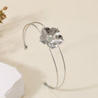 Women's cuff bracelet with artistic leaf motif