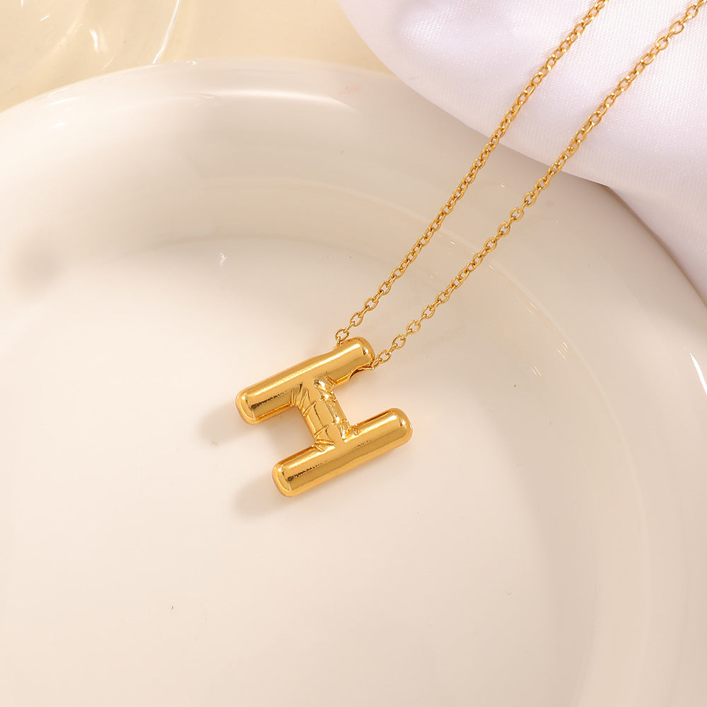 Women's necklace with curved letter pendant