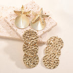 Women's ear clips in luxurious shell and starfish design