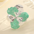 Women's flower-shaped ring made of shiny metal and high-quality epoxy resin