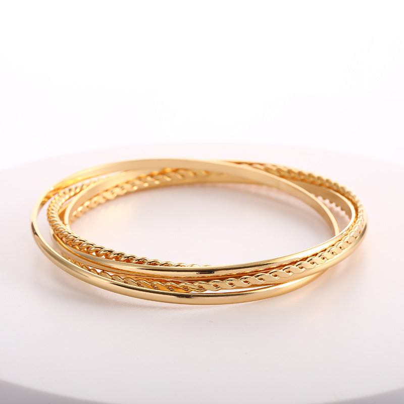 Women's bangle set with elaborate, braided and simple designs