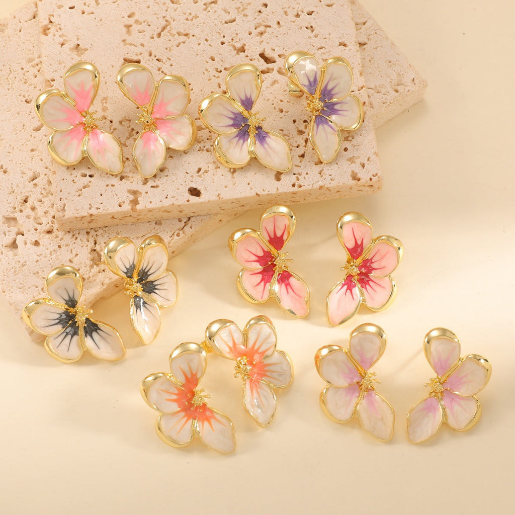 Women's ear clips in elegant floral design with a glossy coating