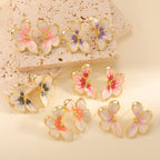 Women's ear clips in elegant floral design with a glossy coating
