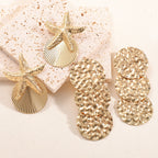 Women's ear clips in luxurious shell and starfish design