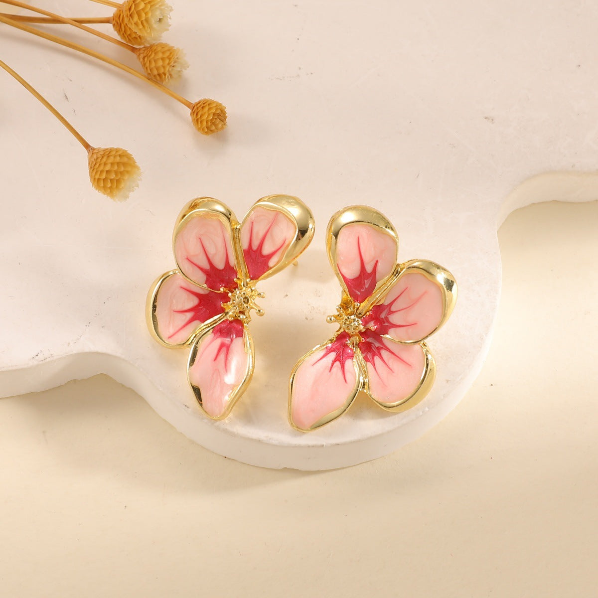 Women's ear clips in elegant floral design with a glossy coating