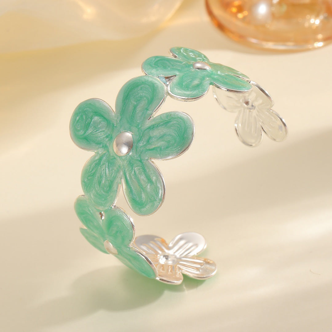 Women's bracelet made of high-quality metal with floral design