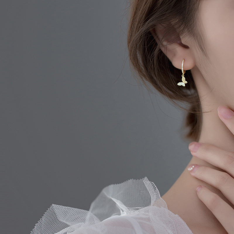 Ladies earrings with elegant butterfly design and sparkling details