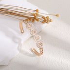 Women's bangle with elegant infinity pattern and sparkling zirconia