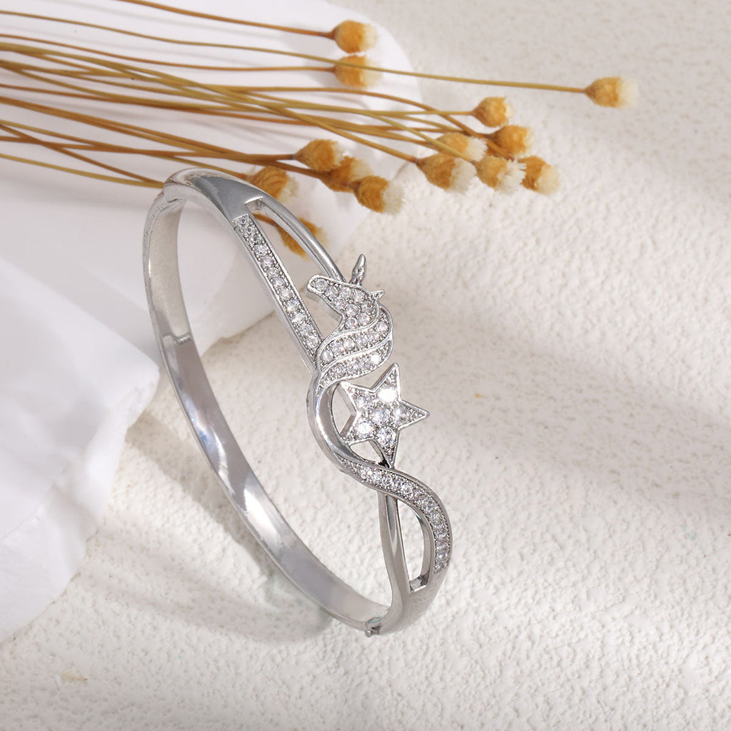 Ladies bracelet with elaborate infinity symbol and sparkling zirconia
