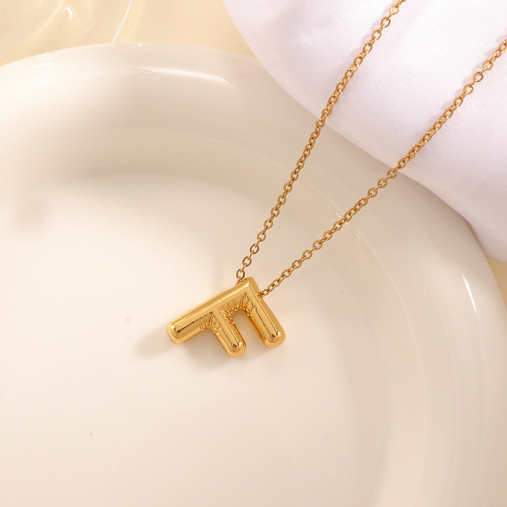Women's necklace with curved letter pendant