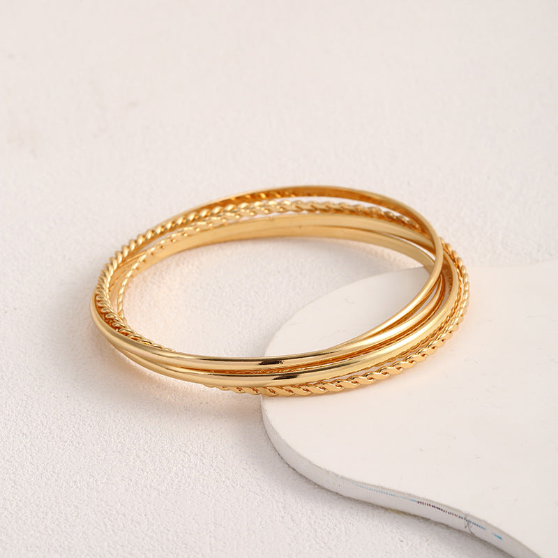 Women's bangle set with elaborate, braided and simple designs