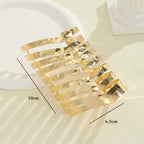 Women's hair accessories with shiny, curved elements