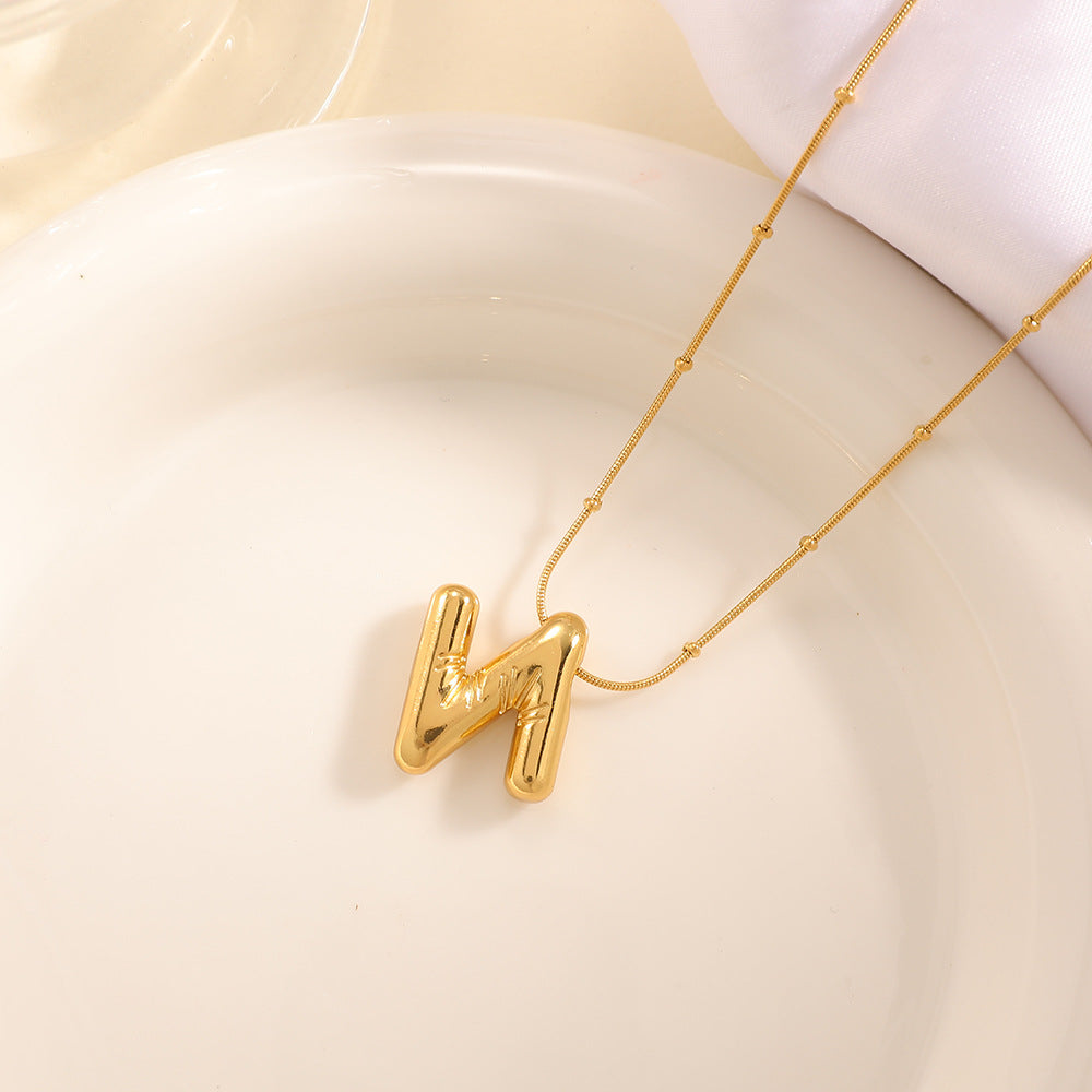 Women's necklace with curved letter pendant