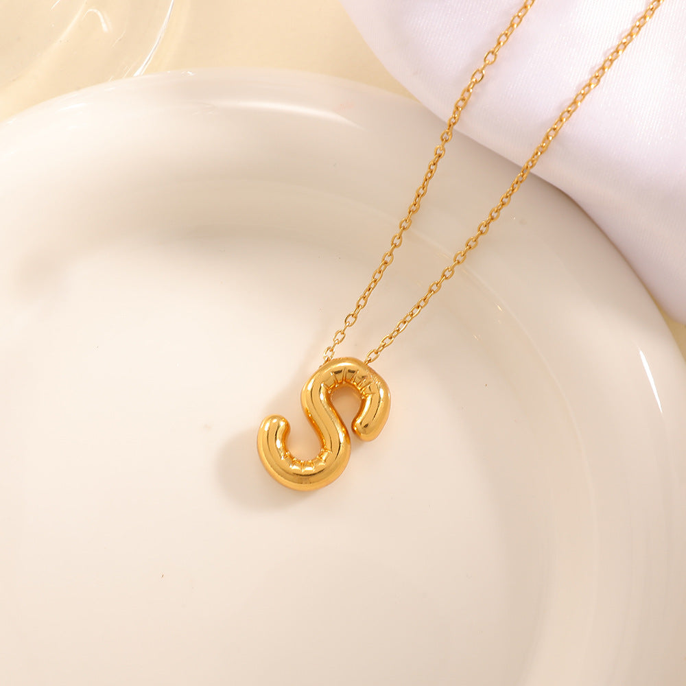 Women's necklace with curved letter pendant