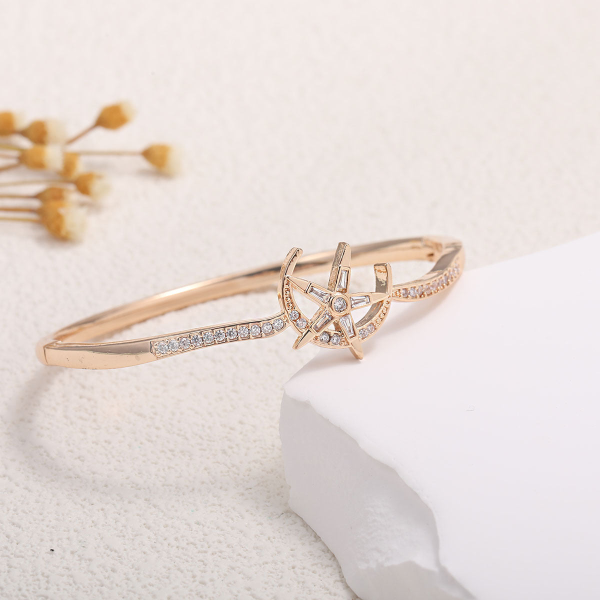Women's bangle with elegant infinity pattern and sparkling zirconia