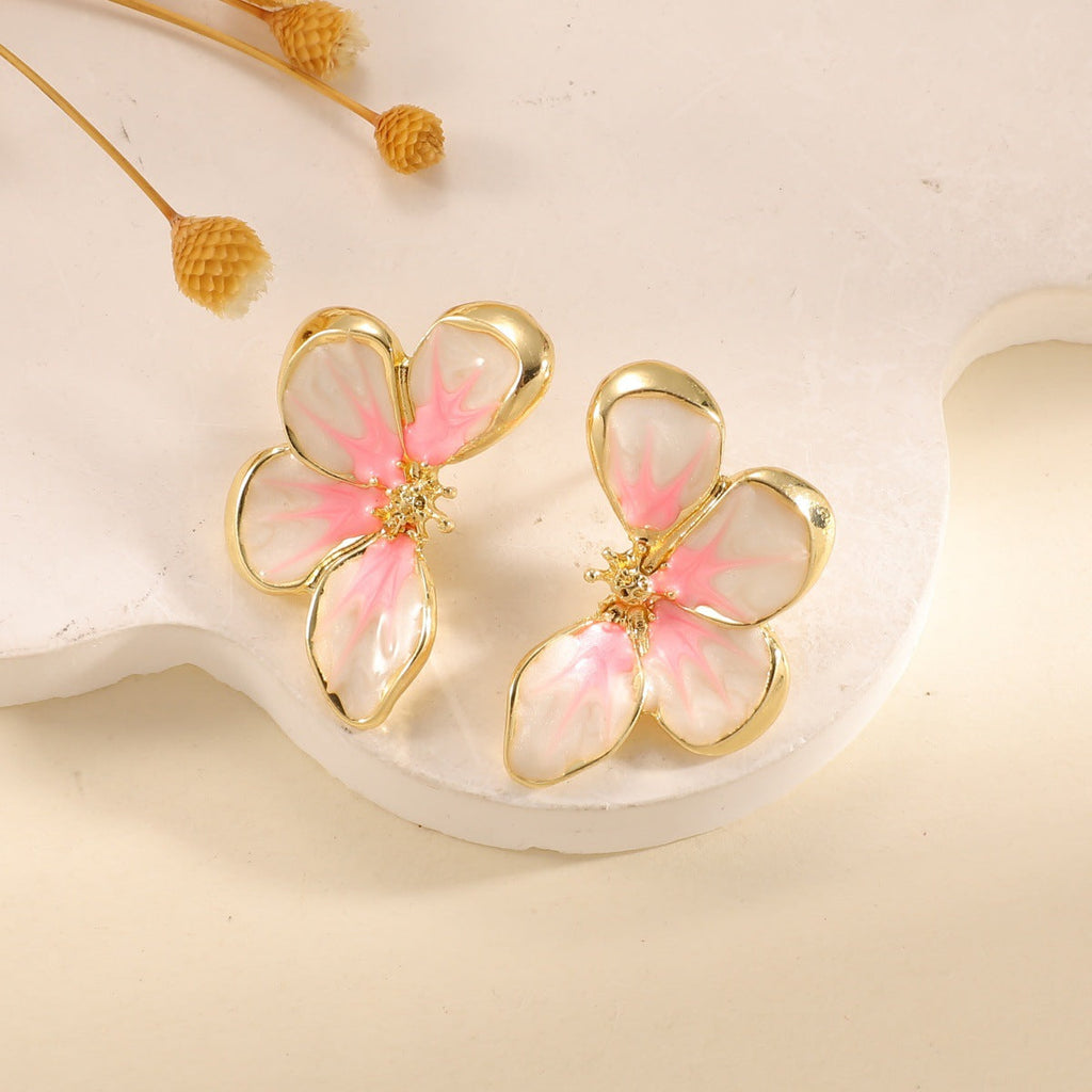 Women's ear clips in elegant floral design with a glossy coating