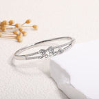 Ladies bracelet with elaborate infinity symbol and sparkling zirconia