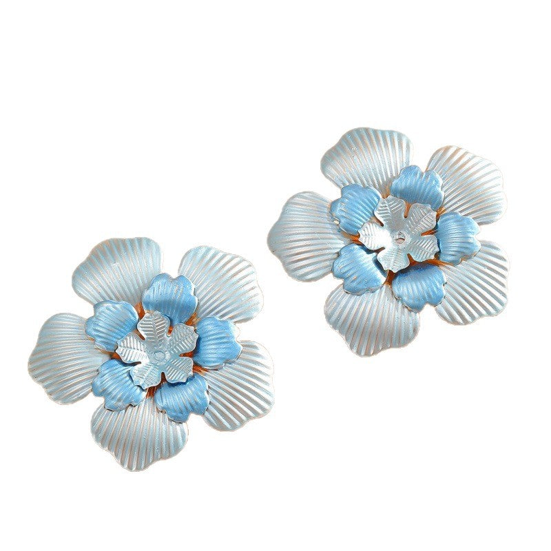 Ladies' flower earrings with intricate design and glossy accents
